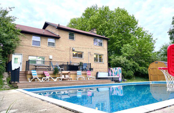 Family Fun at Riverside Pool Paradise! Splash in the pool, relax in the hot tub, or enjoy yard games. Spacious deck with seating! Toddler cabana, & custom art.