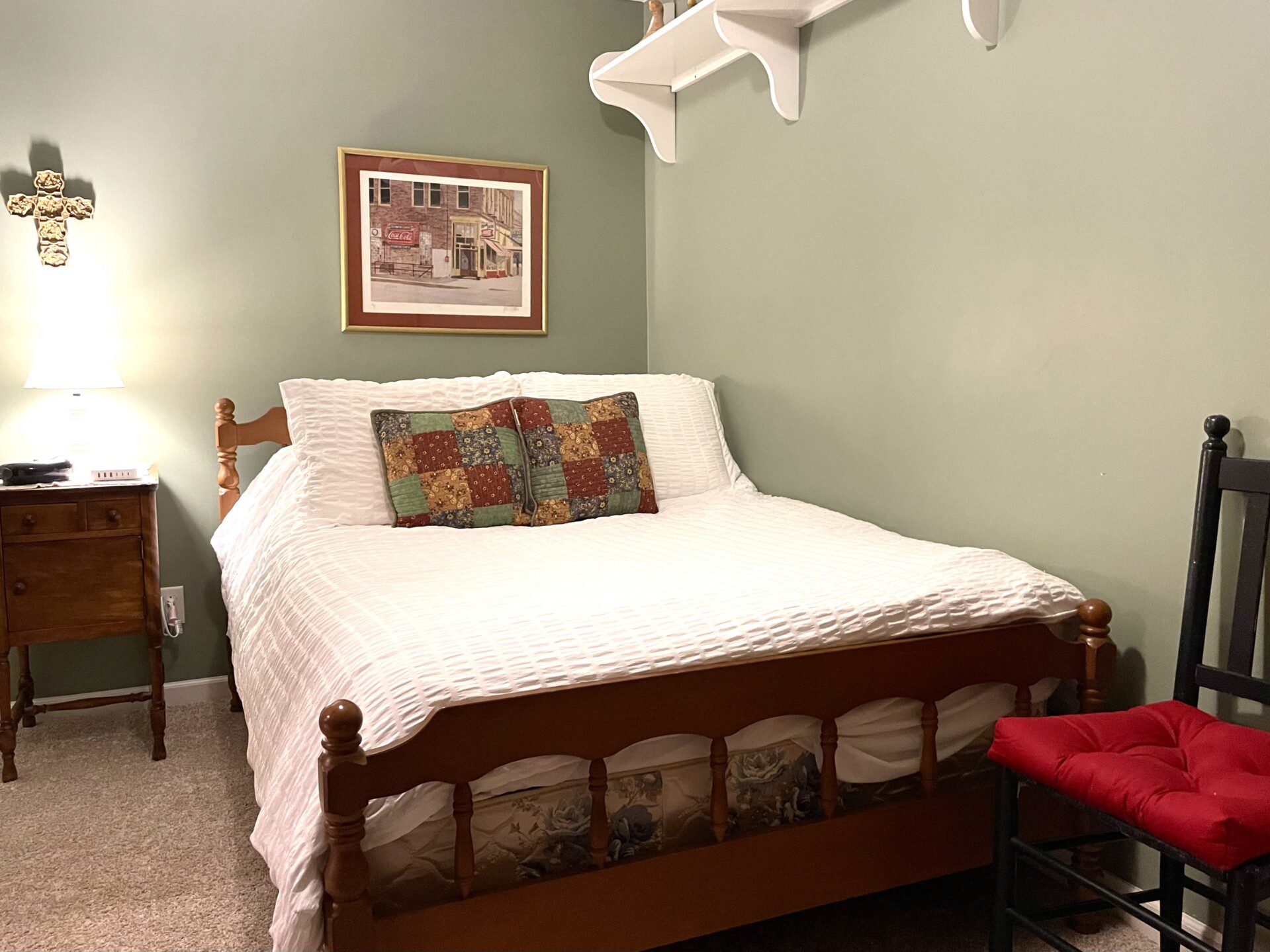 Basement Bedroom: Enjoy a restful stay with a double bed and a convenient charging station on the nightstand.