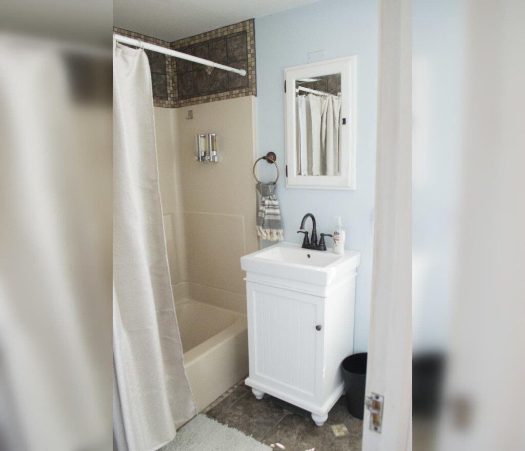 Upstairs bathroom  with shower and tub combination.