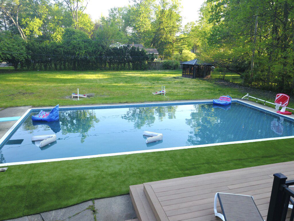 Family Fun at Riverside Pool Paradise! Splash in the pool, relax in the hot tub, or enjoy yard games. Spacious deck with seating! Toddler cabana, & custom art.