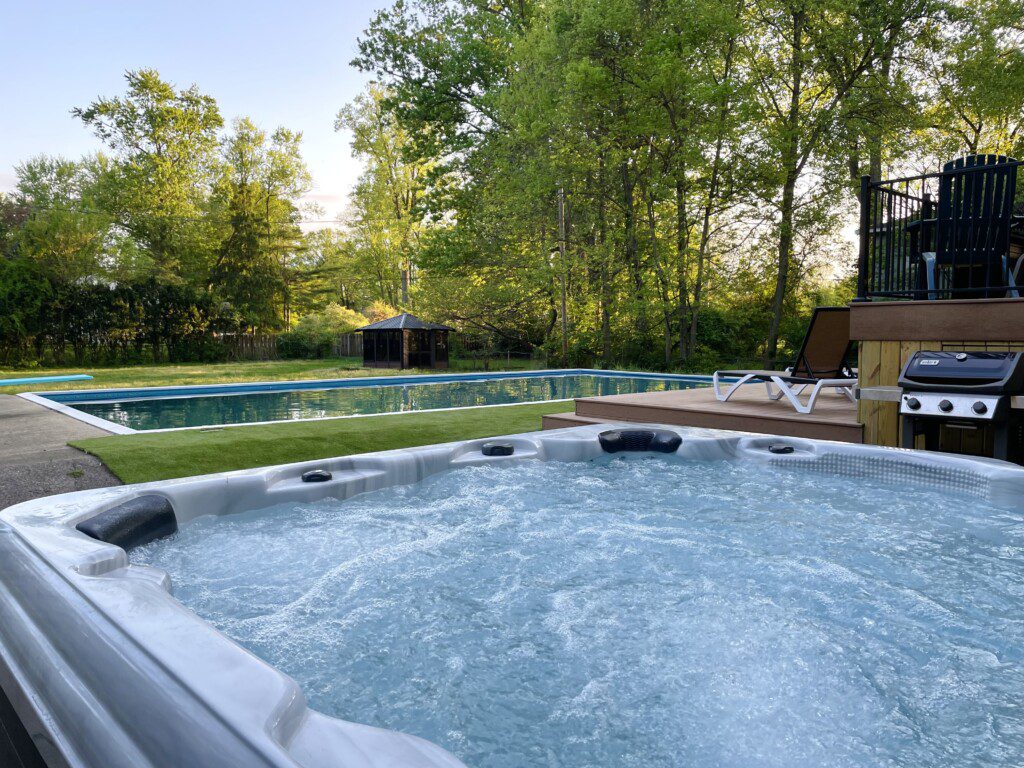 Family Fun at Riverside Pool Paradise! Splash in the pool, relax in the hot tub, or enjoy yard games. Spacious deck with seating! Toddler cabana, & custom art.