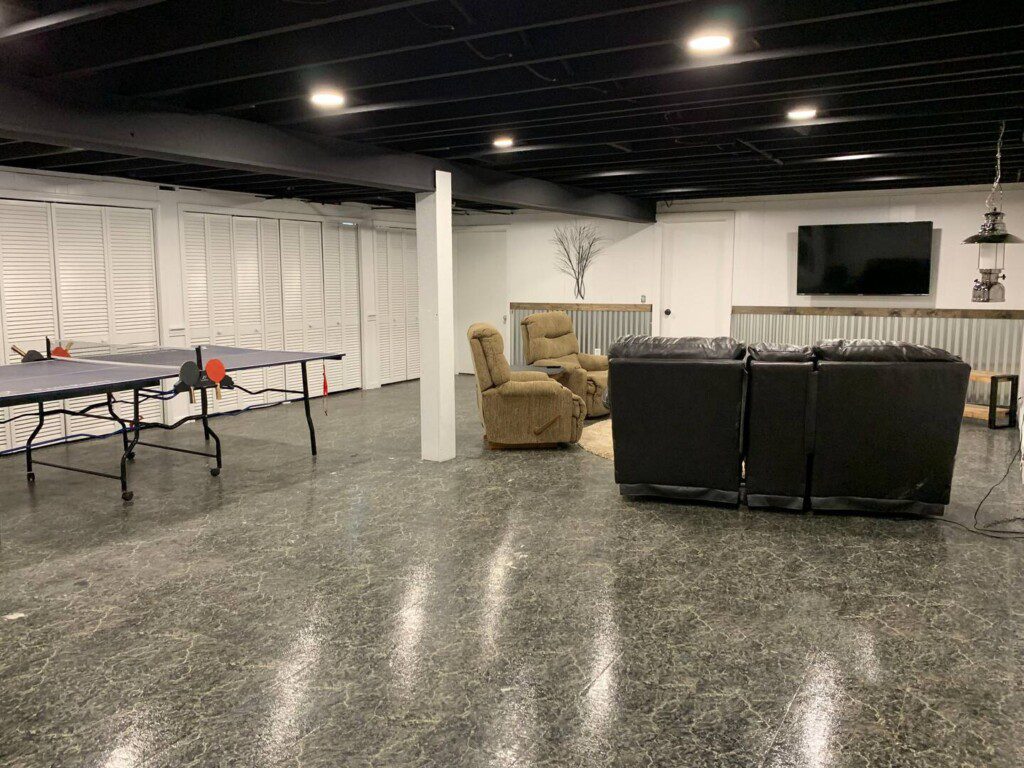 Finished basement! Try your hand at ping pong, compete on a small basketball hoop, or simply relax and watch TV on the 55" TCL Roku TV with complimentary YouTubeTV access.