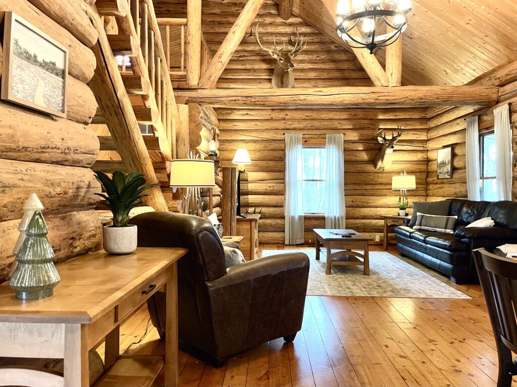 Trillium Lane Cabin Living Room - enjoy the quiet ambiance of the open concept log cabin in the comfortable living room, or enjoy a movie on the 50" Roku Smart TV