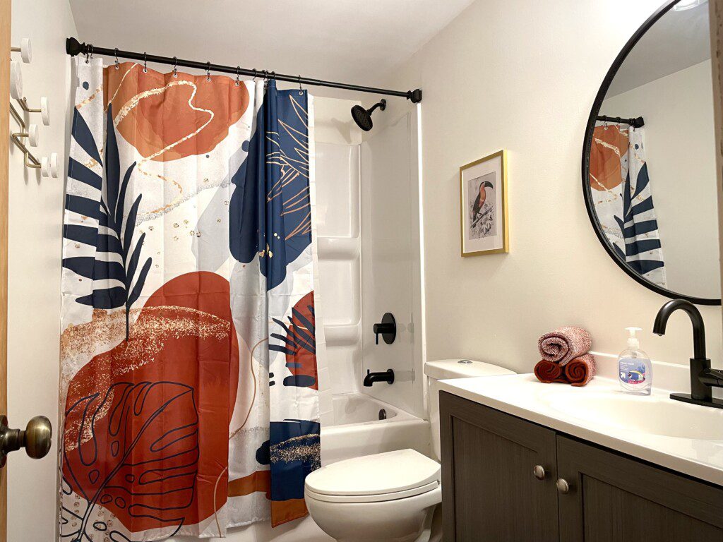Bathroom #1 with shower/tub combination - furnished with towels, washcloths, soap/shampoo/hairdryer, and more