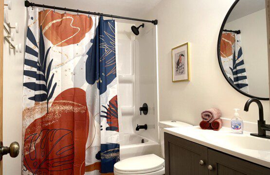 Bathroom #1 with shower/tub combination - furnished with towels, washcloths, soap/shampoo/hairdryer, and more