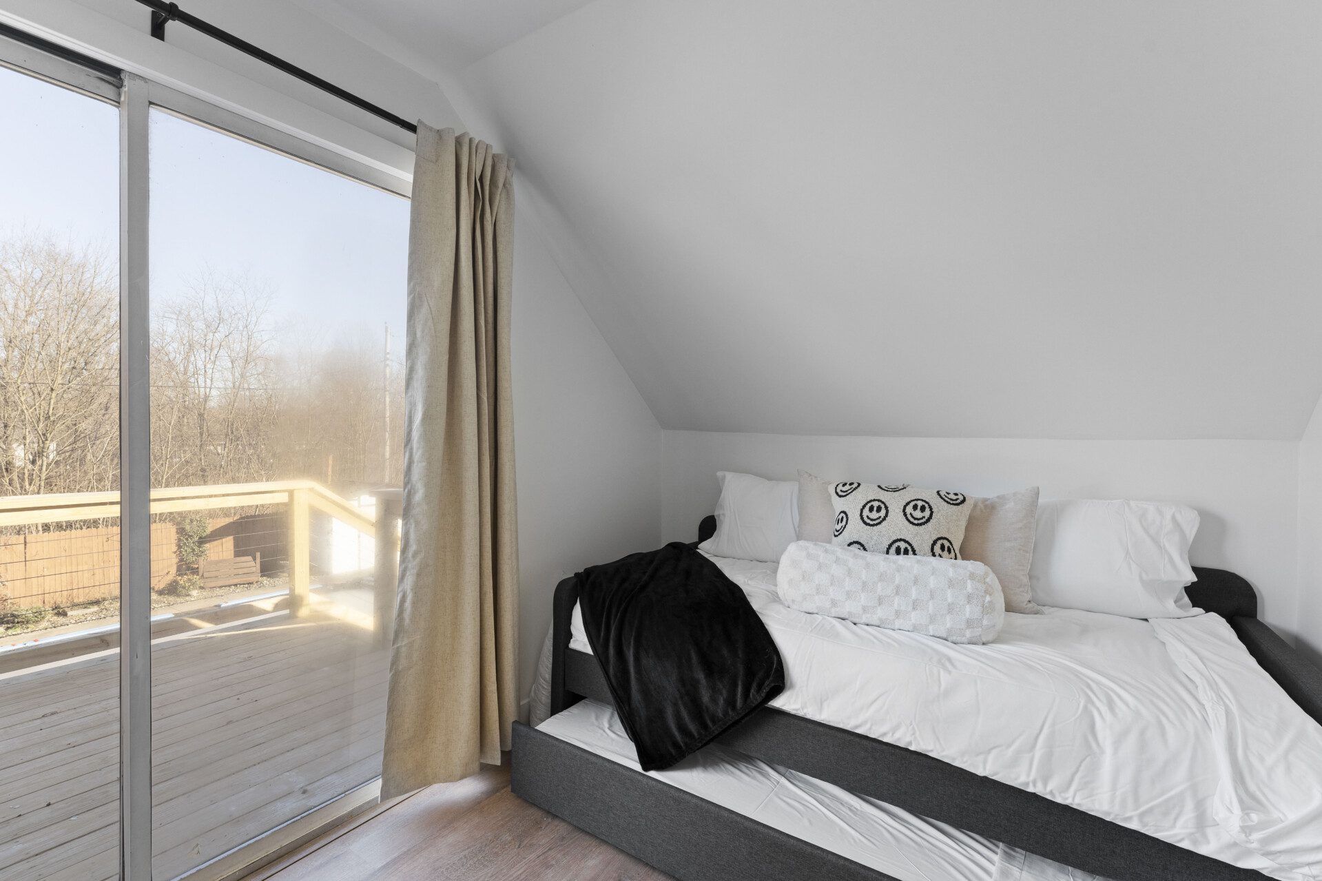 This cozy upstairs bedroom features a twin trundle bed with two twin mattresses—perfect for kids, friends, or extra guests. Please note: this room sleeps two guests total.