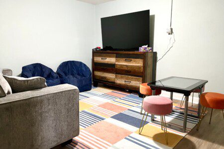 Basement Game Zone & Movie Nights! Unwind downstairs at Riverside Pool Paradise. Challenge friends on the Infinity Game Table (over 50 games!), play classics on the N64 (100s of games provided), or relax with movies on the 65" Fire TV. Sink into comfy beanbags for ultimate relaxation!