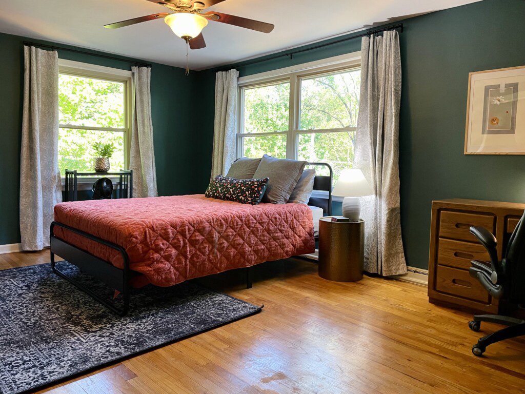 Bedroom #2 with highly rated Lucid queen mattress, a clock w/ USB and outlets to make charging devices super convenient; 43" Roku Smart TV, ceiling fan, small desk for remote work
