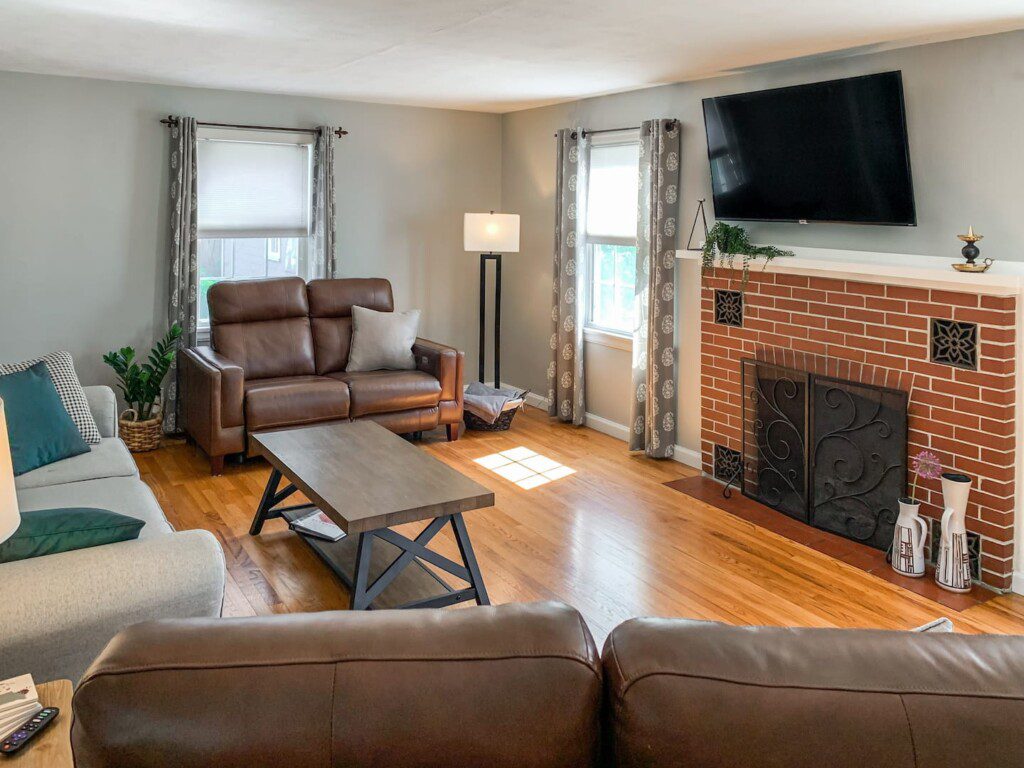 Living Room with 55" Roku TV with YouTube TV access. Very high quality power reclining love seats!!