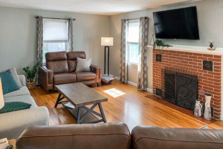 Living Room with 55" Roku TV with YouTube TV access. Very high quality power reclining love seats!!