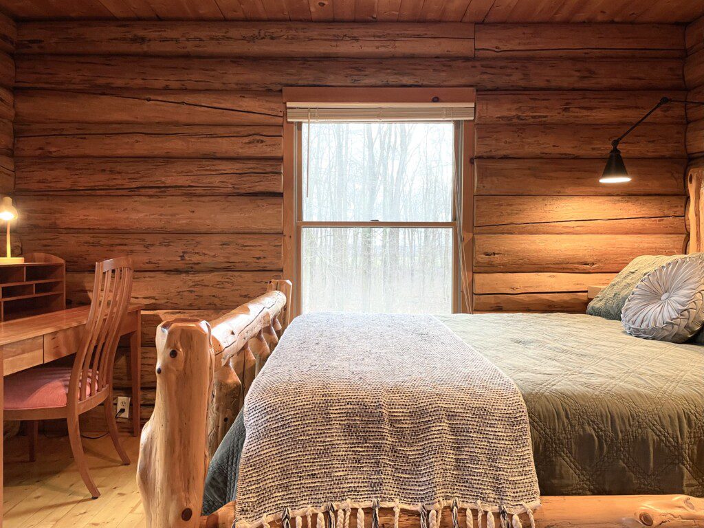 Bedroom #1: main floor private bedroom furnished with a queen bed and workstation for your remote working needs; a clock with USB and outlets to charge your devices