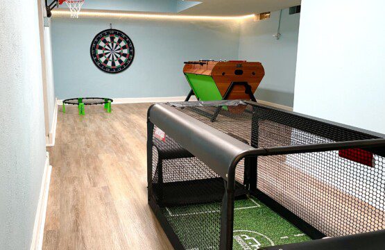 Game On in the Basement! Unwind by the pool, then unleash your competitive spirit in the basement game room - featuring foosball, air hockey, billiards, subsoccer, basketball, giant wall connect four, ball darts and more!