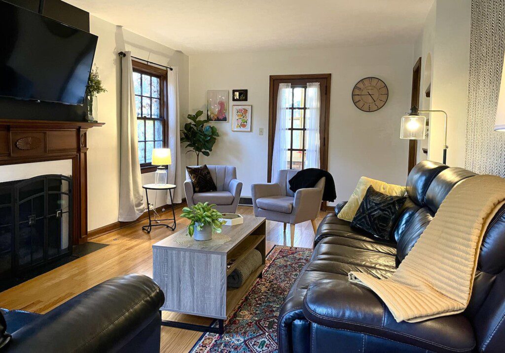 TheBrickHouse Living Room - 55" Roku TV with YouTube TV access provided. Enjoy the comfortable and sofa options, along with a pull out bed.