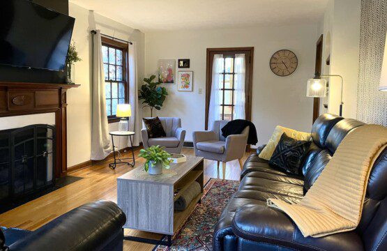 TheBrickHouse Living Room - 55" Roku TV with YouTube TV access provided. Enjoy the comfortable and sofa options, along with a pull out bed.