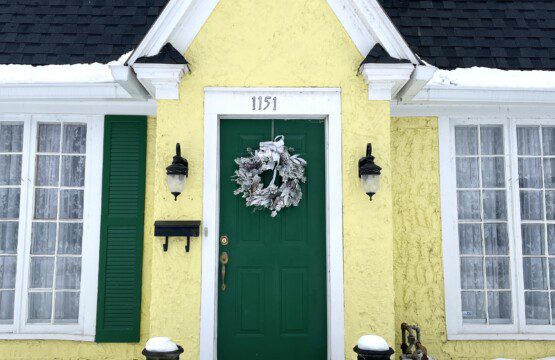 Welcome home! 🌿🏡 This inviting yellow cottage with its bold green door and charming wall lanterns makes a first impression you'll never forget — your retreat is ready and waiting for you.