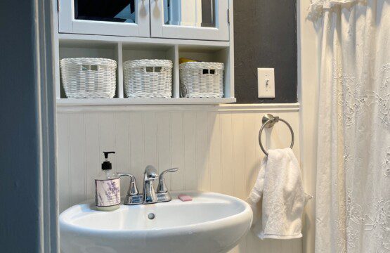 A fresh, clean bathroom ready for your morning routine 🚿🤍 — classic white tiling, a bright pedestal sink, and a welcoming shower to start every day feeling refreshed and renewed.
