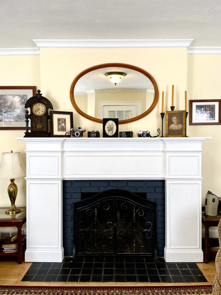 Step back in time and soak in the character of this gorgeous fireplace mantel 🕰️🤍 — with antique touches and a classic oval mirror, it's the kind of charm you'll want to come back to.