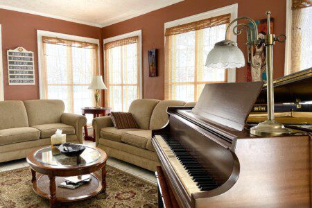 Play a melody or simply admire the elegance 🎹✨ — this stunning grand piano anchors a warm, inviting living room where you can relax, entertain, and truly feel at home in style.